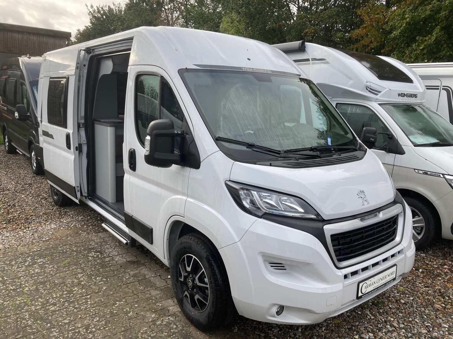 Wohnmobil Peugeot Boxer Weinsberg 600 MQ CaraTour mit 4 Sitzen und 3 Schlafplätzen
