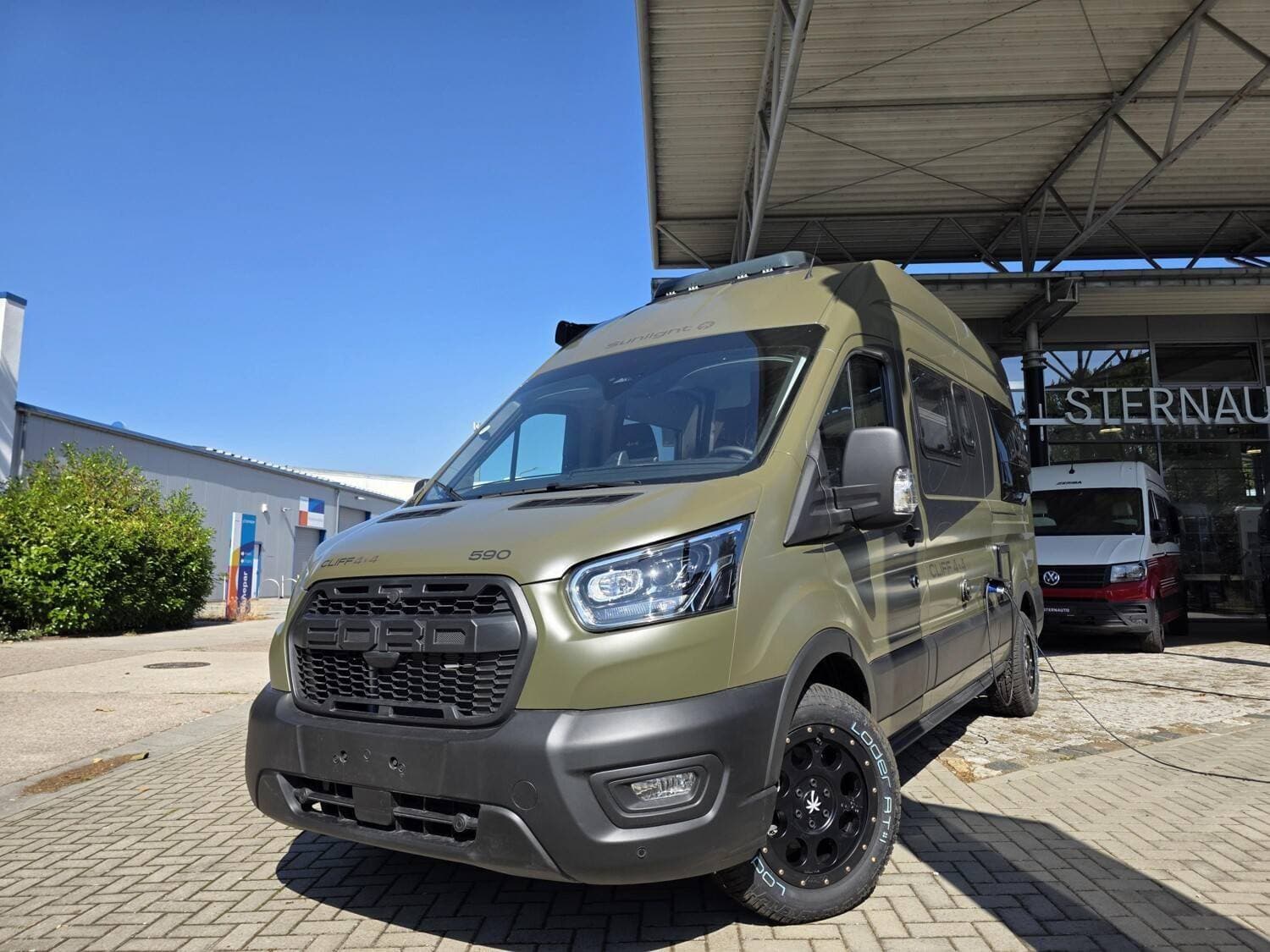 Wohnmobil Sunlight Cliff 4x4 Greentrek 590 mit 4 Sitzen bei STERNAUTO GmbH Wohnmobil Ford Transit Sunlight 590 Cliff 4x4 Greentrek mit 4 Sitzen und 2 Schlafplätzen